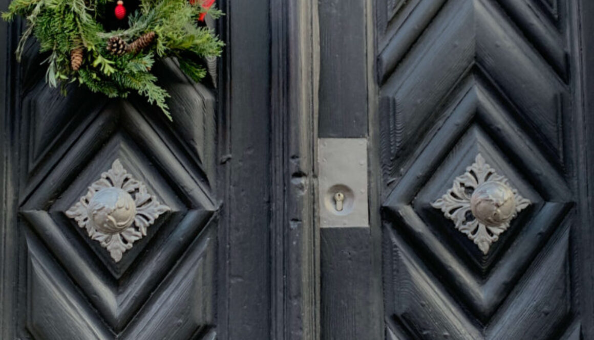 Green Christmas Decor on Black Door