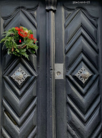 Green Christmas Decor on Black Door